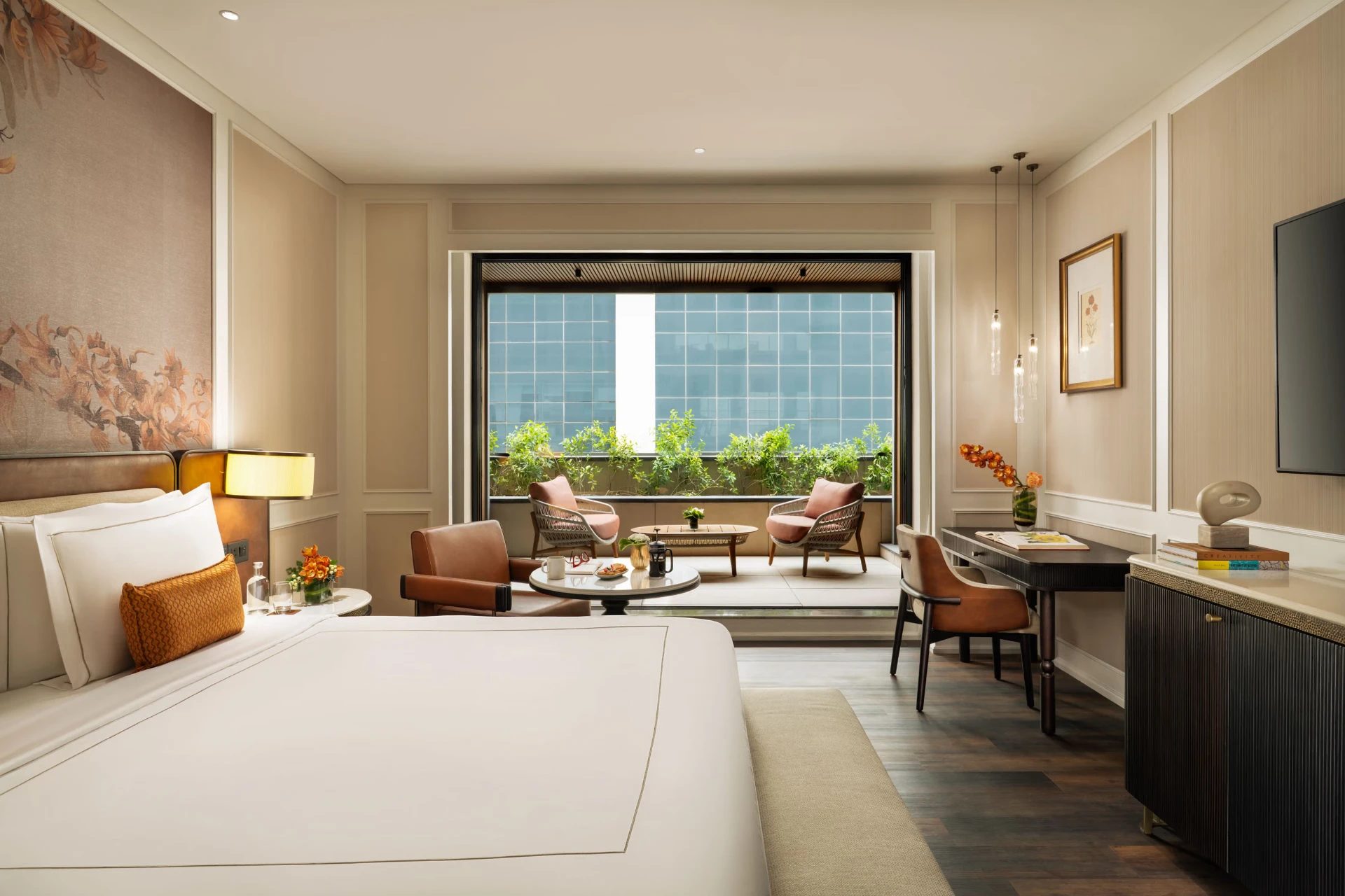 Guest room with a king bed, seating area and large window